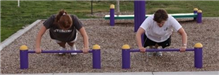 Two People Using Push-Up Bars