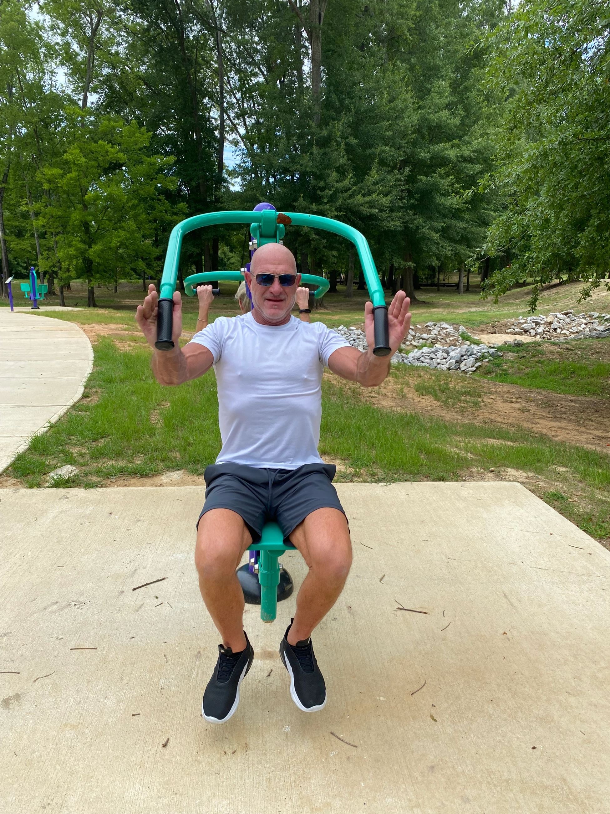 Man Using Chest Press Equipment