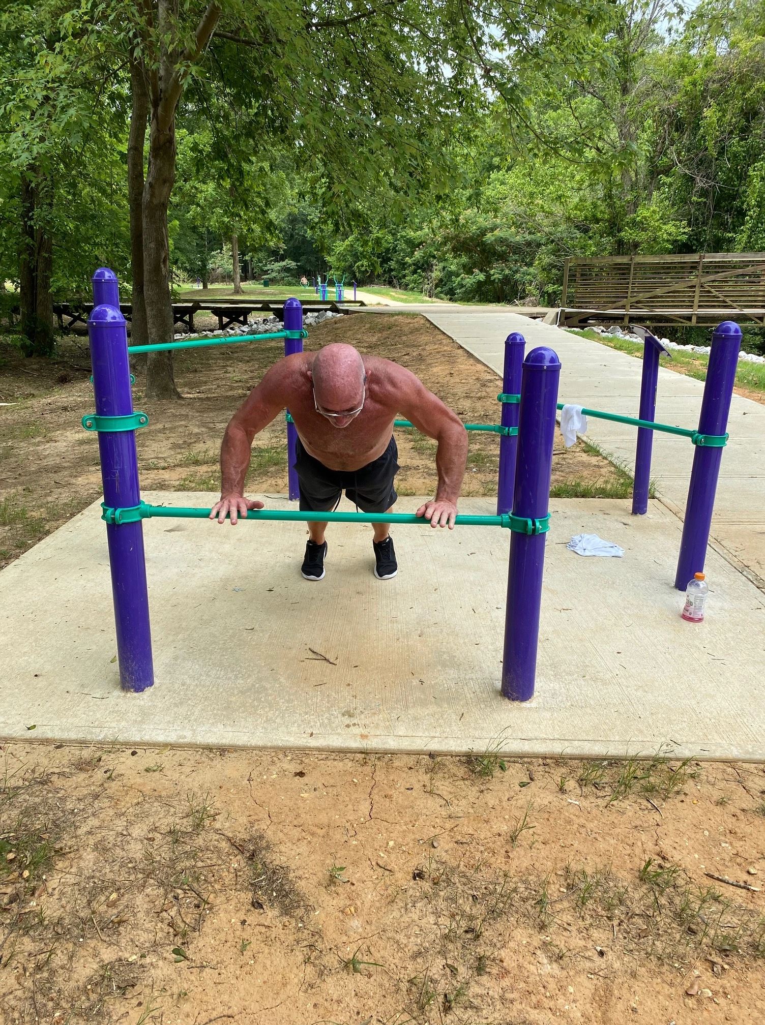 Man Utilizing the Strength and Stretch Bar