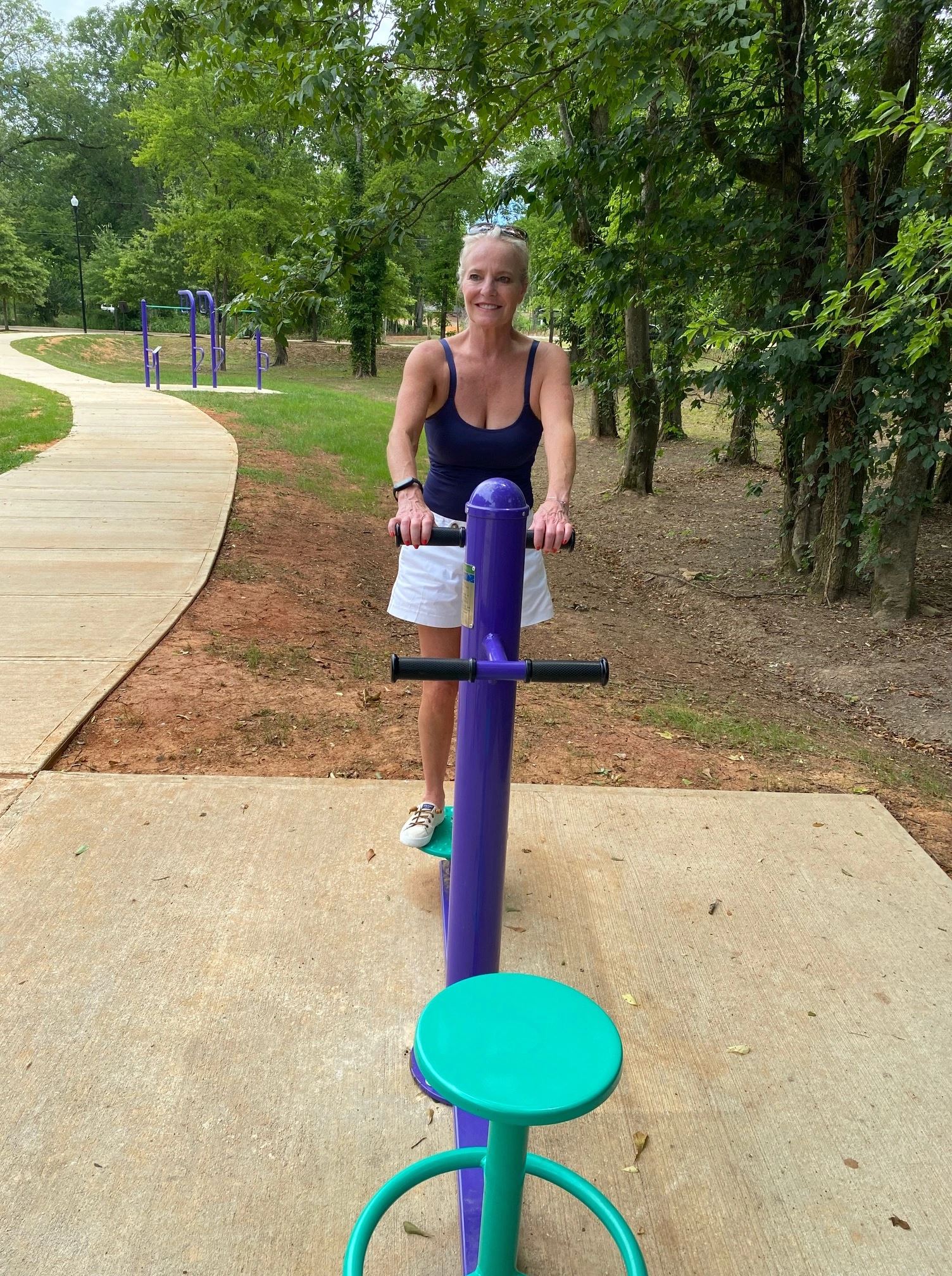 Woman Using Two-Sided Rotator Equipment