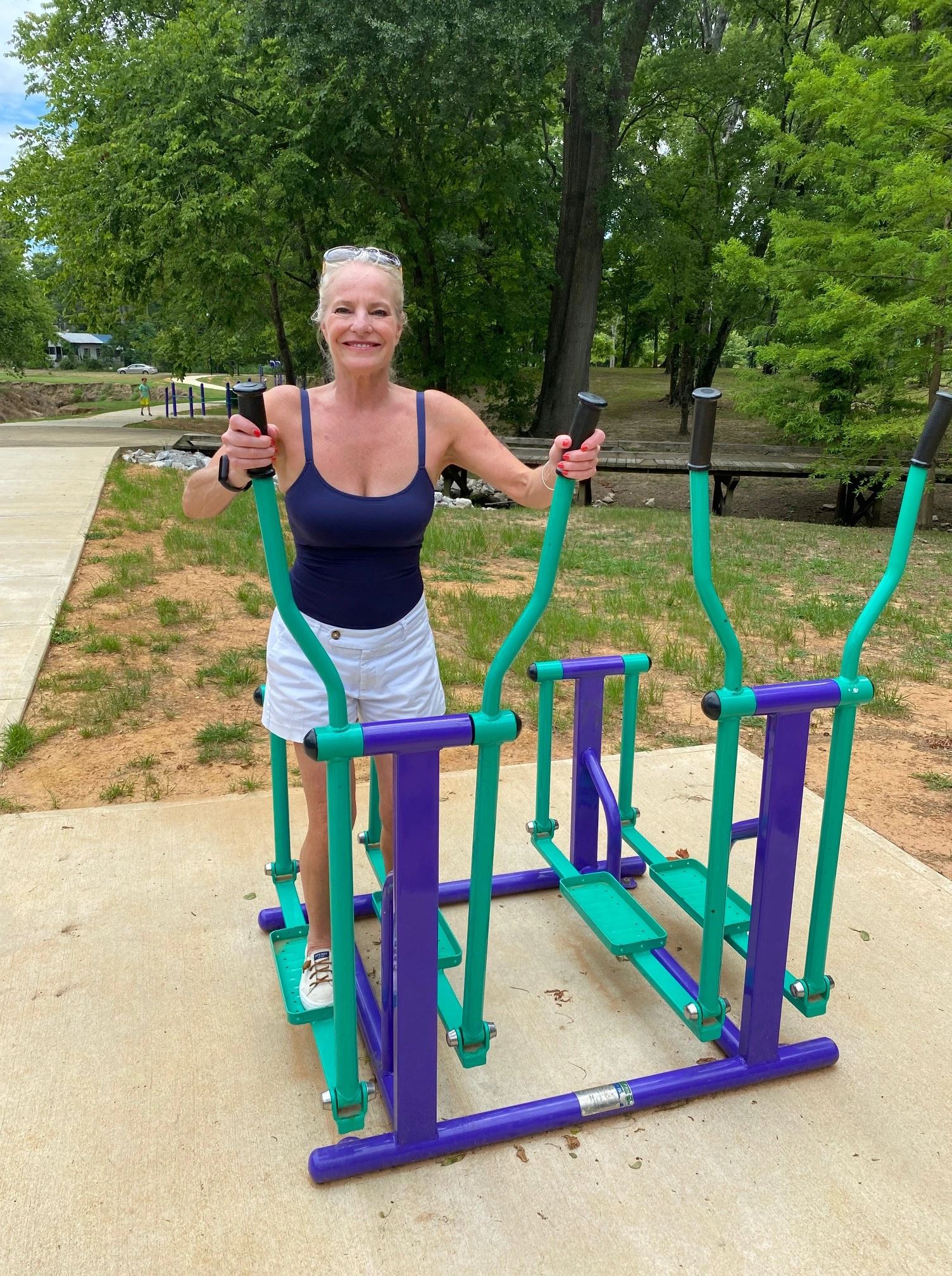 Woman Utilizing the Elliptical Machine